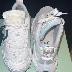 Womens off-white sneakers.